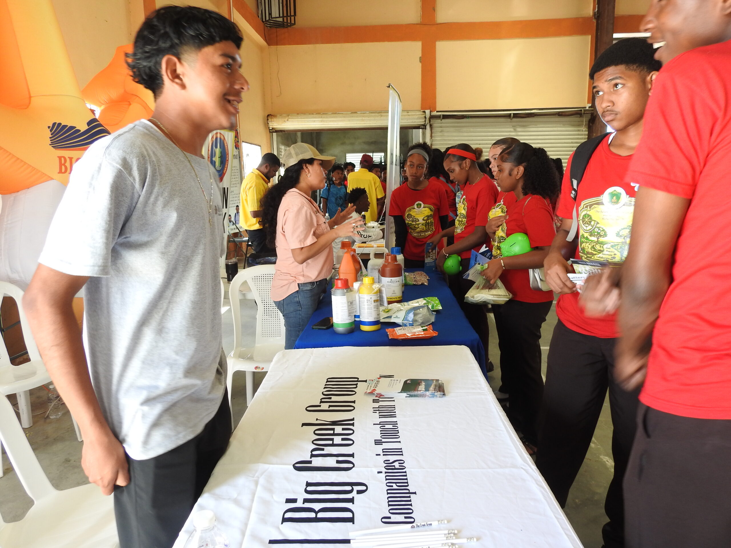 Belagro team explaining to IHS students