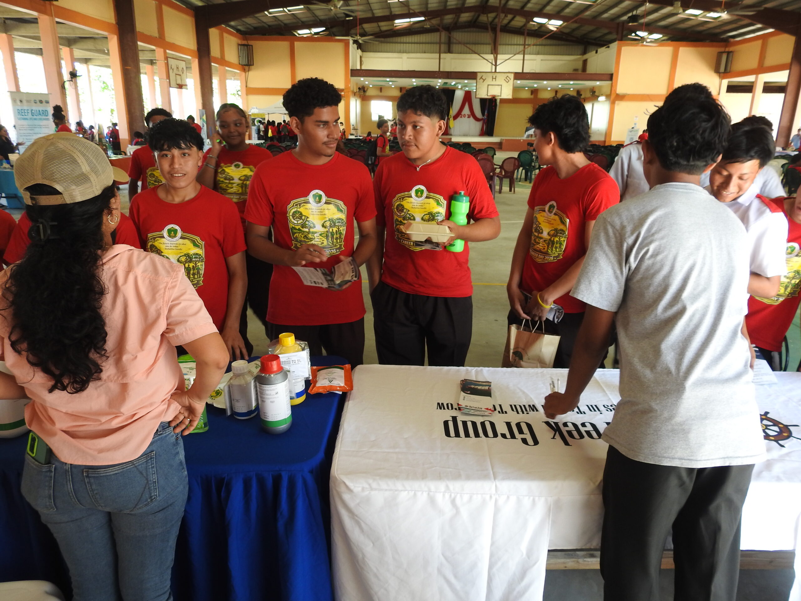 Belagro team explaining to IHS students